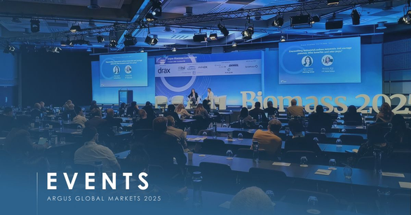 Delegates at tables watching a stage talk, Biomass 2025 lettering behind, card marked Argus Global Markets 2025