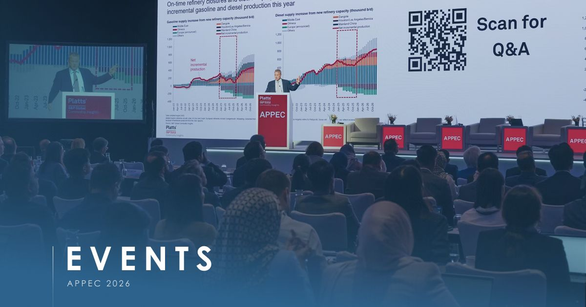 Audience at APPEC 2026 watching a speaker present refinery supply charts beside a Scan for Q&A code