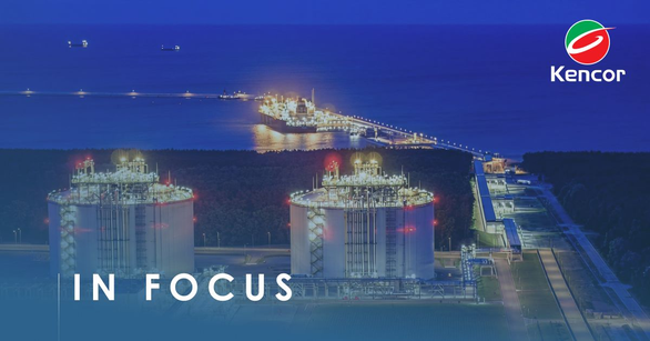 Oil storage terminal with two lit tanks and a jetty at dusk, Kencor logo in the corner